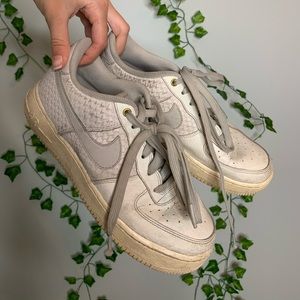 Worn white Nike air shoes